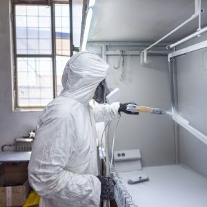 Worker at Work: Compressor Painting